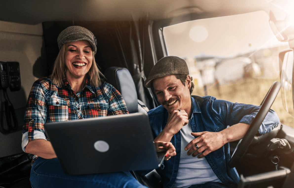 2 people looking at their next shipment on portable device